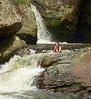 Enjoying a refreshing dip in the cascade